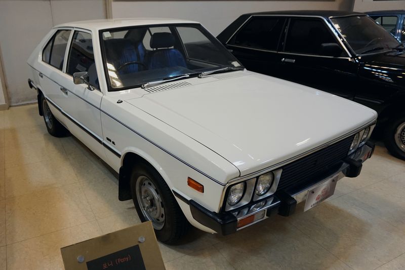 A first-generation Hyundai Pony on display in a Korean motor museum