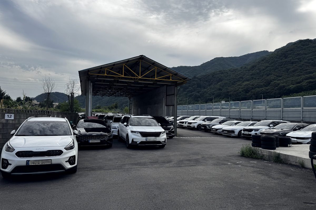 MK1 vehicle yard in Yeoncheon-gun — export-ready cars parked in rows